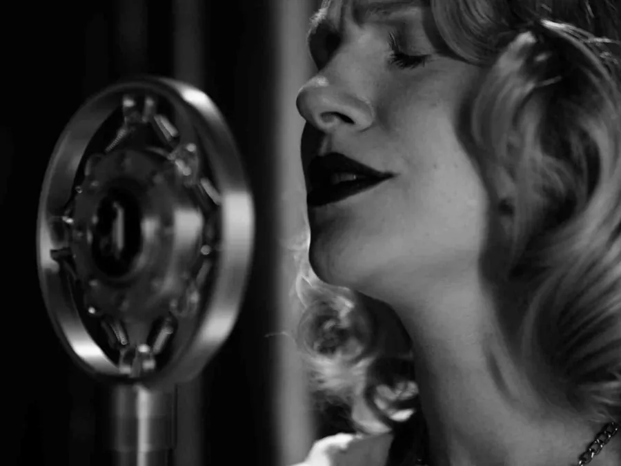A singer at a vintage microphone
